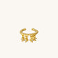 A stunning gold-plated cuff earring adorned with three tiny diamonds, perfect for adding a touch of glam to any outfit.
