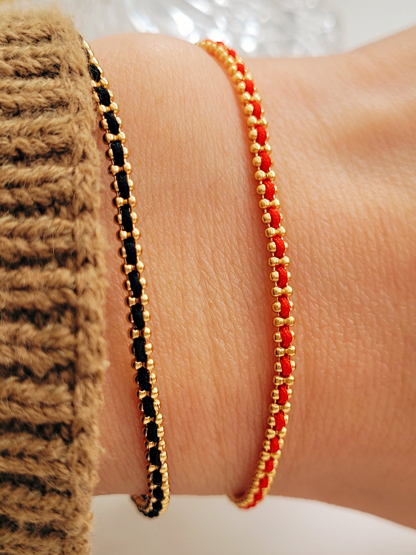 Gold-plated sterling silver string bracelets in Black, Blue, Red and Pink, perfect as friendship bracelets or meaningful graduation gifts for everyday wear.
