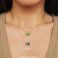 A close-up of a pair of natural jade charm necklace, featuring an icy green jade or icy blue jade pendant on a gold-plated sterling silver chain, showcasing a delicate and elegant look.