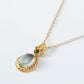 Close-up of pale blue topaz oval pendant necklace with vintage gold detailing. Perfect anniversary gift for her.