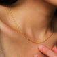 Model wearing a gold chain beaded necklace crafted in 18k gold plated sterling silver, showcasing its minimalist and dainty details
