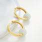 Luxurious gold hoop earrings  crafted in yellow gold vermeil embellished with pristine genuine jade stones, a statement of refined taste and elegance.