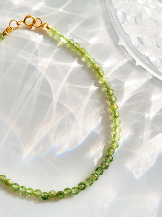 Close-up of natural peridot gemstone beads bracelet