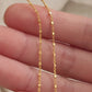 close up of a square beaded gold chain necklace, dainty and delicate, unique style everyday jewellery for women
