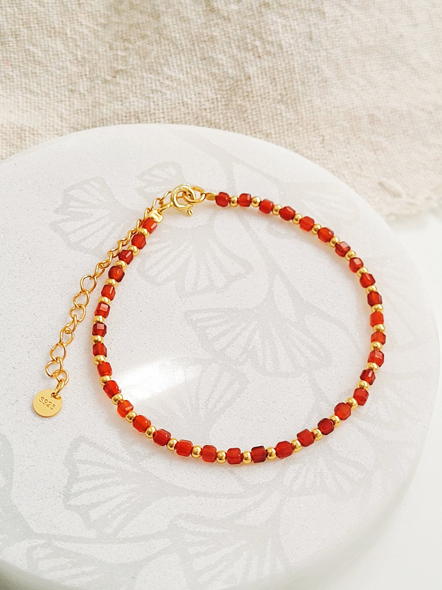 Stackable red onyx gemstone bracelet with 22k gold vermeil details