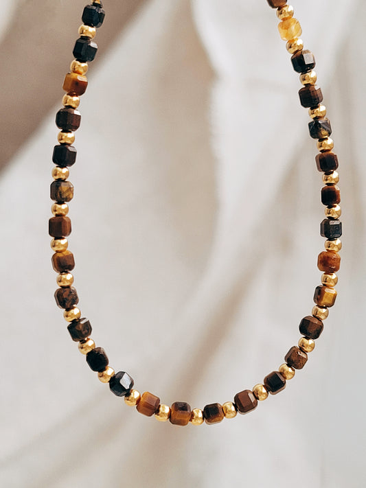 Close-up of Tiger’s Eye bracelet with shimmering gold beads